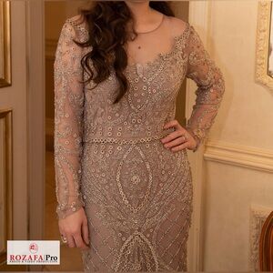 Worn once back has zipper long sleeve with belt runs small fits like size 4-6